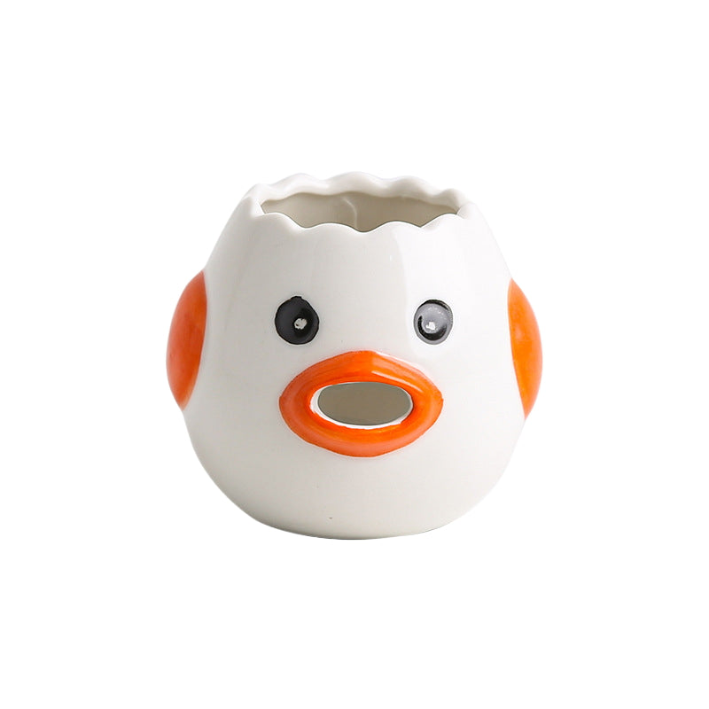 Separador de yema y clara de huevo de gallina vomitando