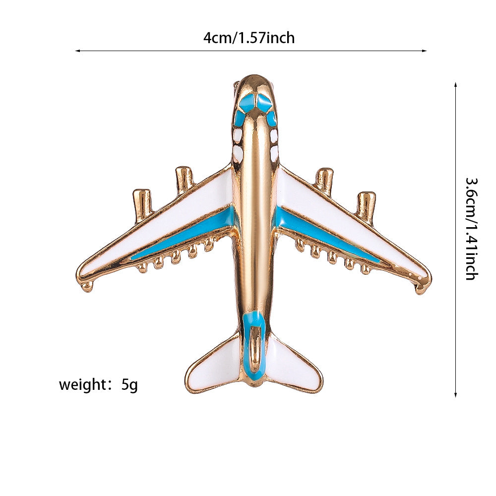 Pines de solapa con forma de avión y barco