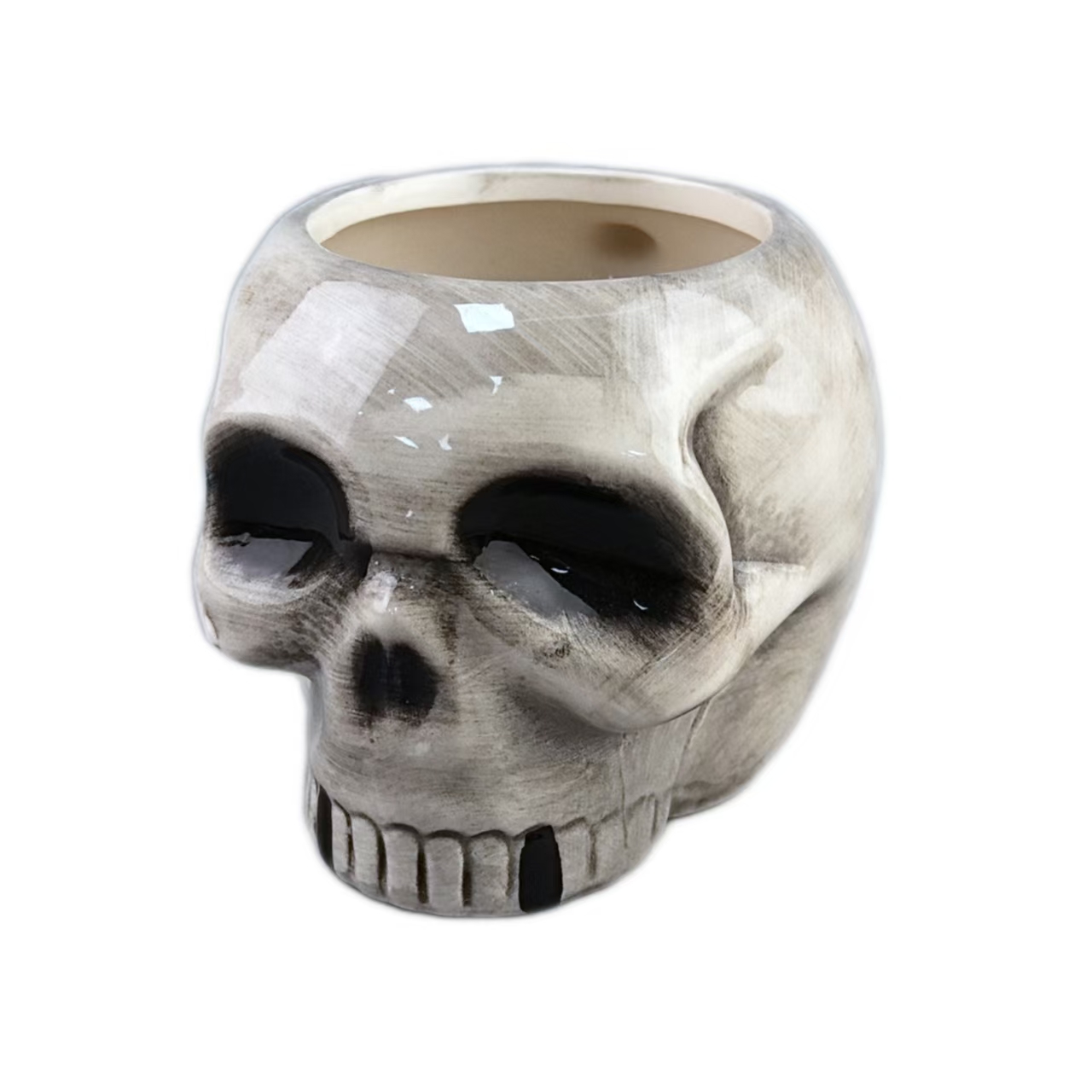 Taza de cerámica en forma de cráneo